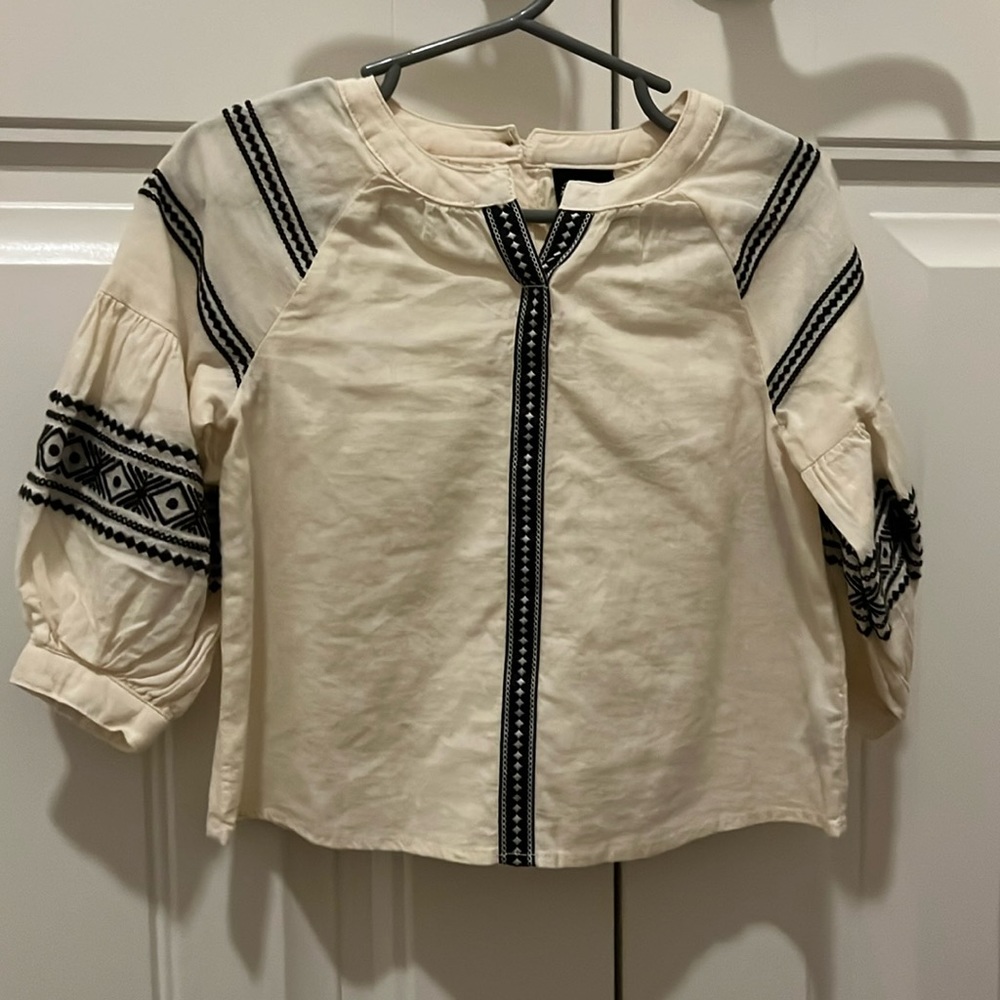 Cream baby girls blouse with black embroidery